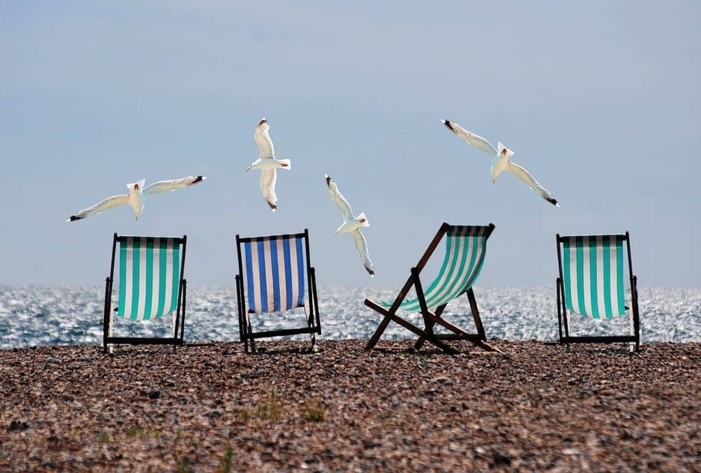 Deckchairs on a pebble beach